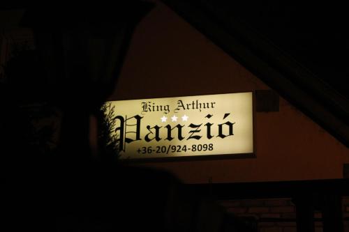 a sign on a building that reads king arthur elkin at King Arthur Panzió in Baja