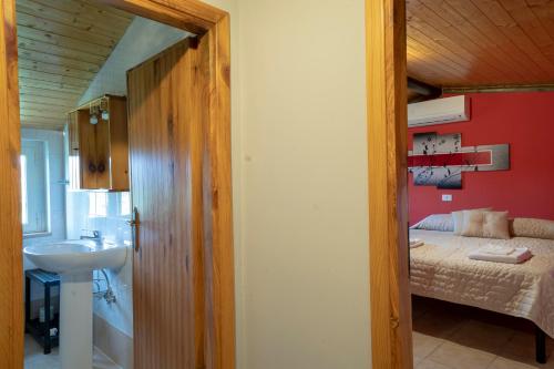 Ένα ή περισσότερα κρεβάτια σε δωμάτιο στο Agriturismo La Ginestra