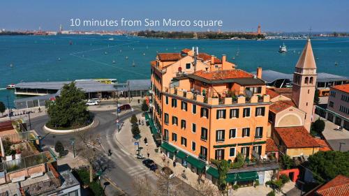 a large building with a view of the ocean at Hotel Riviera Venezia Lido in Venice-Lido