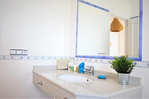 a bathroom with a sink and a large mirror at Siamoformentera Valentina in Sant Francesc Xavier