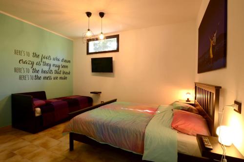 Een bed of bedden in een kamer bij B&B La La Rose