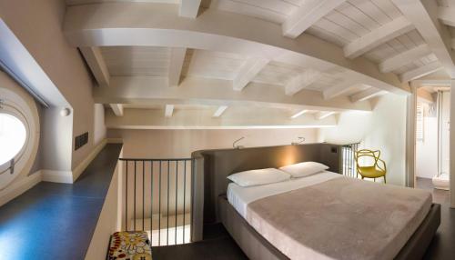 a bedroom with a large bed in an attic at Casa Turrisi in Taormina