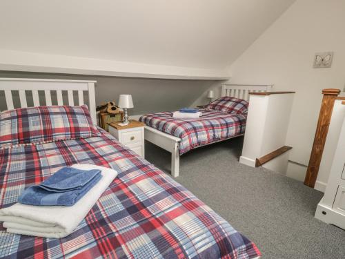 Ένα ή περισσότερα κρεβάτια σε δωμάτιο στο Brickfield Cottage