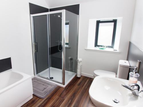 a bathroom with a shower and a sink at Nef-Stedi in Kirktown of Bourtie