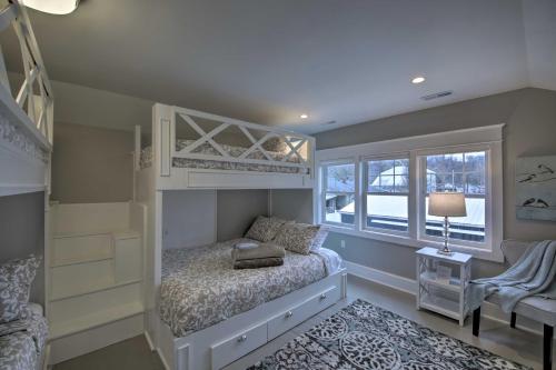a small bedroom with a bunk bed and a window at Renovated Craftsman House with Patio and Fire Pit! in Vevay