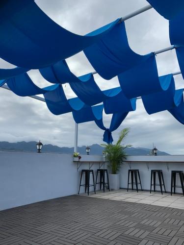 a view from the roof of a bar with stools at 910 Hostel (Chengdong) in Yuli