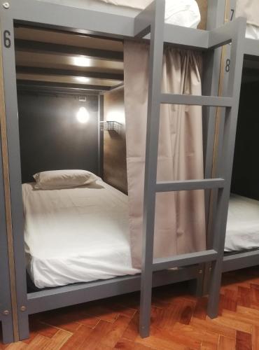 a bunk bed room with two bunk beds at Draft Hostel & Rooms in Lisbon