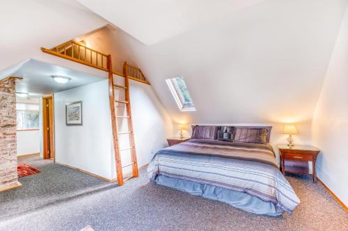 a bedroom with a bed and a ladder at HATS House in Coos Bay