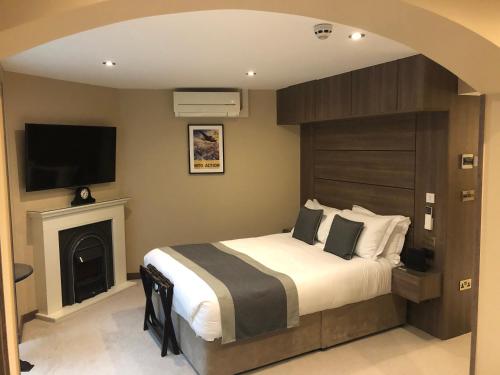 Ein Bett oder Betten in einem Zimmer der Unterkunft St Paul's Hotel