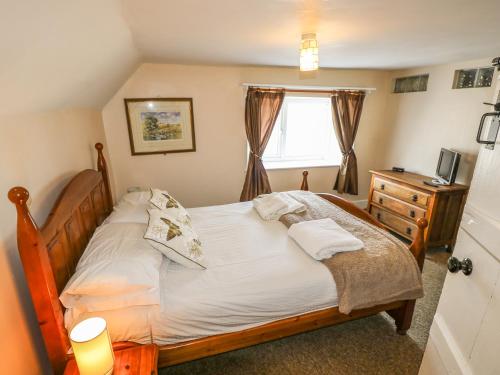 Ένα ή περισσότερα κρεβάτια σε δωμάτιο στο Hill Farm Cottage