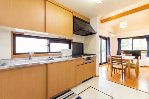 a kitchen with a sink and a counter top at Regina Ishigaki Kabira Sky / Two-Bedroom House in Kabira
