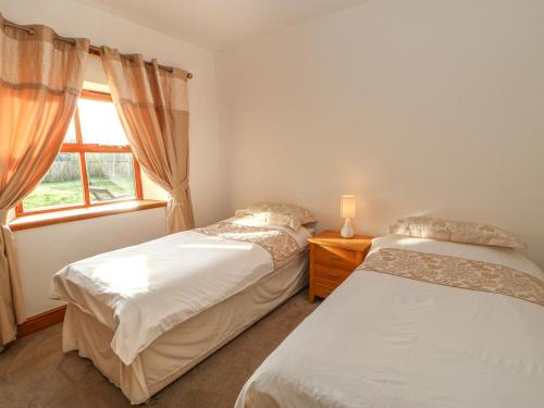 Ліжко або ліжка в номері Swift Cottage