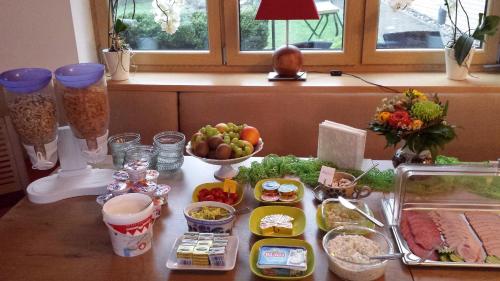 a table with food and other foods on it at Gasthaus & Pension Am Rennsteig in Spechtsbrunn