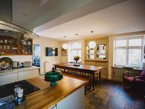 a kitchen with a table and a dining room at The Crow's Nest in Pittenweem