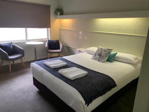 Postelja oz. postelje v sobi nastanitve Finley Country Club Hotel Motel