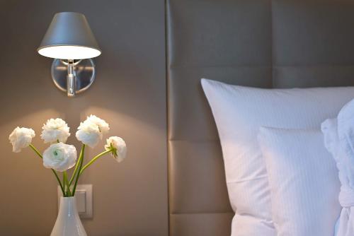 Ένα ή περισσότερα κρεβάτια σε δωμάτιο στο Hotel AM MEER & Spa