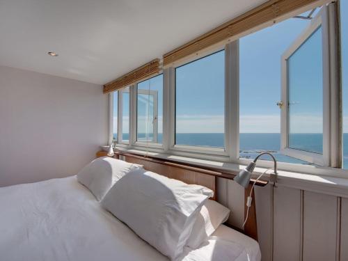 Ένα ή περισσότερα κρεβάτια σε δωμάτιο στο The Captains House