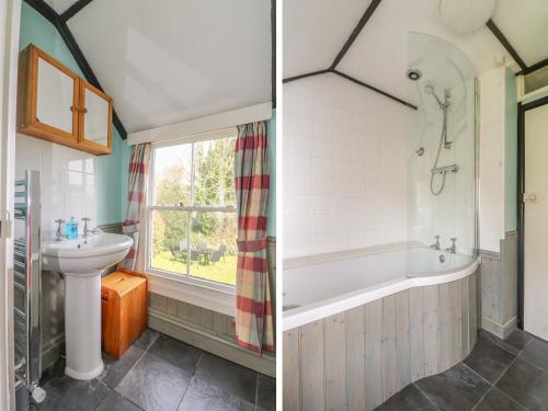 a bathroom with a bath tub and a sink at Boundys House in St Ives