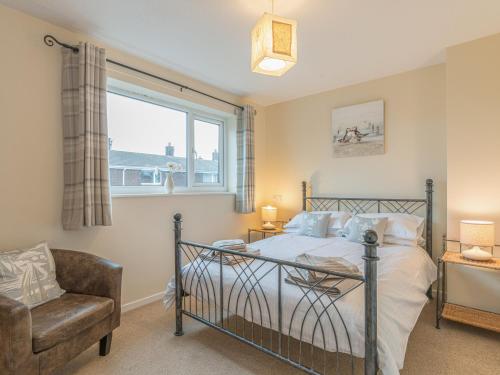 En eller flere senge i et værelse på Crumstone Corner