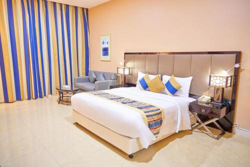 Кровать или кровати в номере City Stay Grand Hotel Apartments - Al Barsha