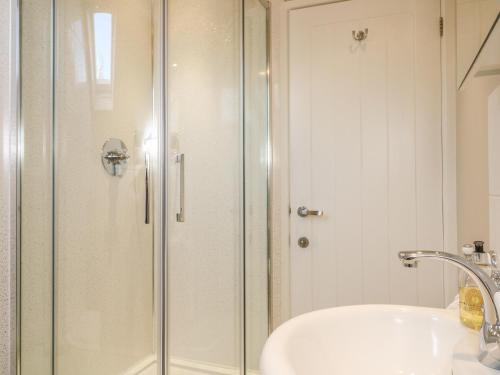 a bathroom with a shower and a sink at Temple Mews in Stow on the Wold