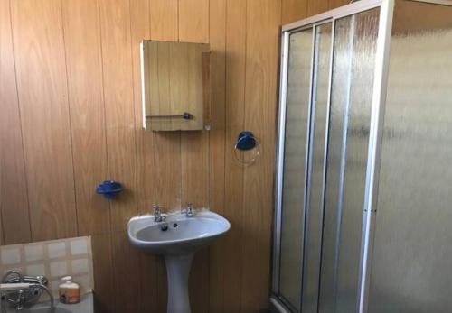 a bathroom with a sink and a shower at Fly Shack in Dullstroom