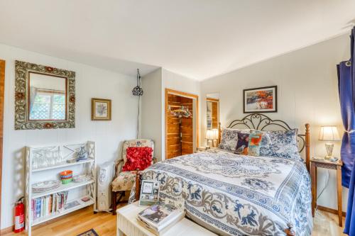 a bedroom with a bed and a chair at Redwood Roost in Arcata