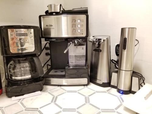 a kitchen counter with a coffee maker and a blender at 7 BR- Sleeps 15! Famous Lakefront Amazing Property! in New Orleans