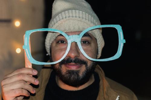 a man with glasses on his face at AmigosIndia in New Delhi