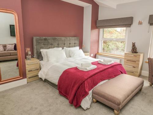 Ένα ή περισσότερα κρεβάτια σε δωμάτιο στο Ellie's Lodge
