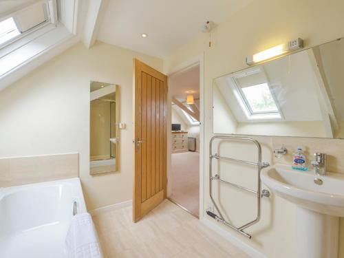 a bathroom with a sink and a shower and a toilet at St Aubyn Cottage in Plymouth