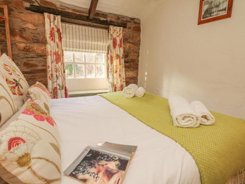 Postel nebo postele na pokoji v ubytování May Cottage