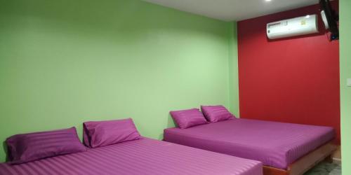 Postel nebo postele na pokoji v ubytování Yahle Villa เยห์เล่วิลล่า