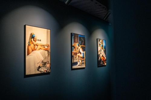 a group of pictures on a wall in a room at The Collector in The Hague