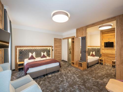 Postel nebo postele na pokoji v ubytování Hotel Stegerbräu