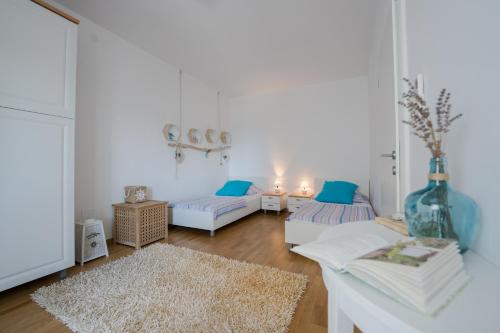 Katil atau katil-katil dalam bilik di Šolta Life Apartments