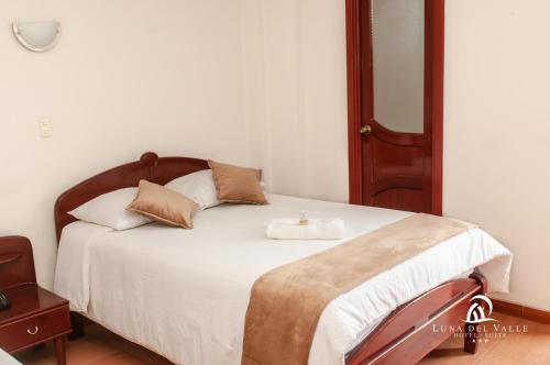 Postel nebo postele na pokoji v ubytování Hotel Suite Luna del Valle