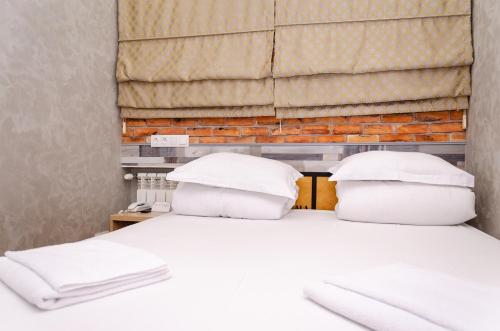Кровать или кровати в номере My Hostel Almaty
