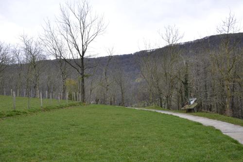 a park with a bench and a grass field at CASA RURAL Arriaran in Leitza