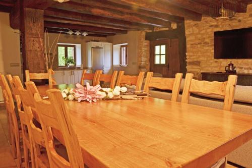 a wooden table with chairs and a dining room at CASA RURAL Arriaran in Leitza