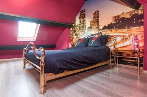 a bedroom with a large bed in a pink room at Duplex appertement met zicht Damse vaart @ Brugge in Bruges