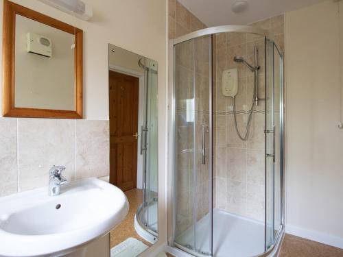 a bathroom with a sink and a shower at Little Barn in Wincanton