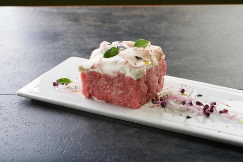 a piece of red velvet cake on a white plate at La Locanda del Priore in Vale