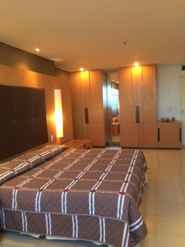 a bedroom with a large bed in a room at Tropical Barra Hotel in Rio de Janeiro
