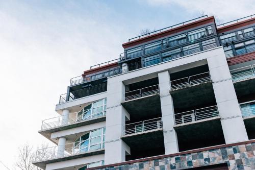an apartment building with balconies on the side of it at River's Edge Hotel Portland, Tapestry Collection by Hilton in Portland