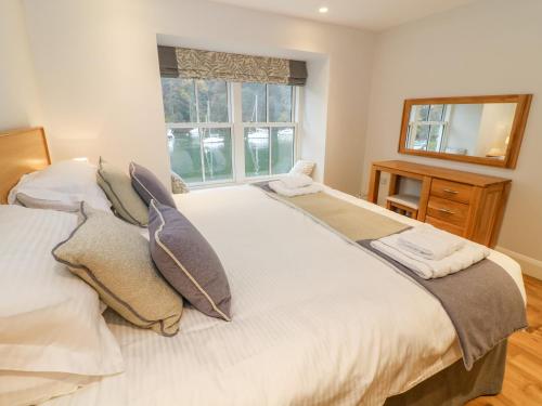 Un pat sau paturi într-o cameră la Pearsall