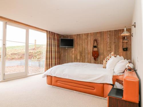 Postel nebo postele na pokoji v ubytování Butlers Lodge