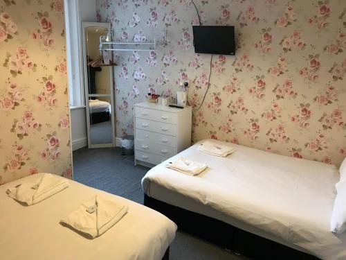 Ein Bett oder Betten in einem Zimmer der Unterkunft The Orbiston