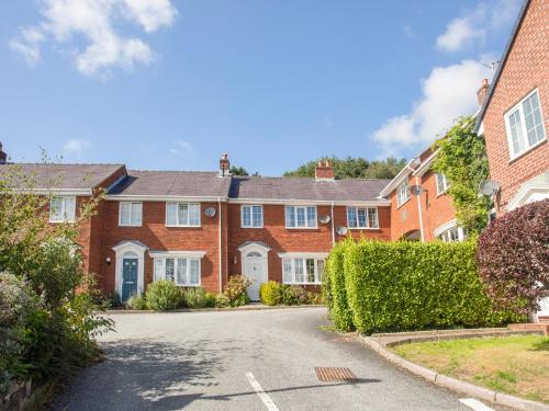 a row of brick houses in a street at Sea View Cottage in Menai Bridge