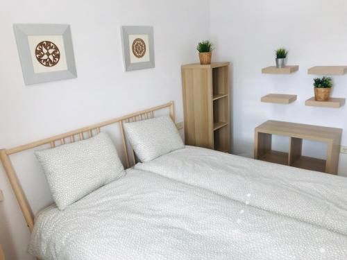 Posteľ alebo postele v izbe v ubytovaní Casa Pura Vida Guardamar del Segura